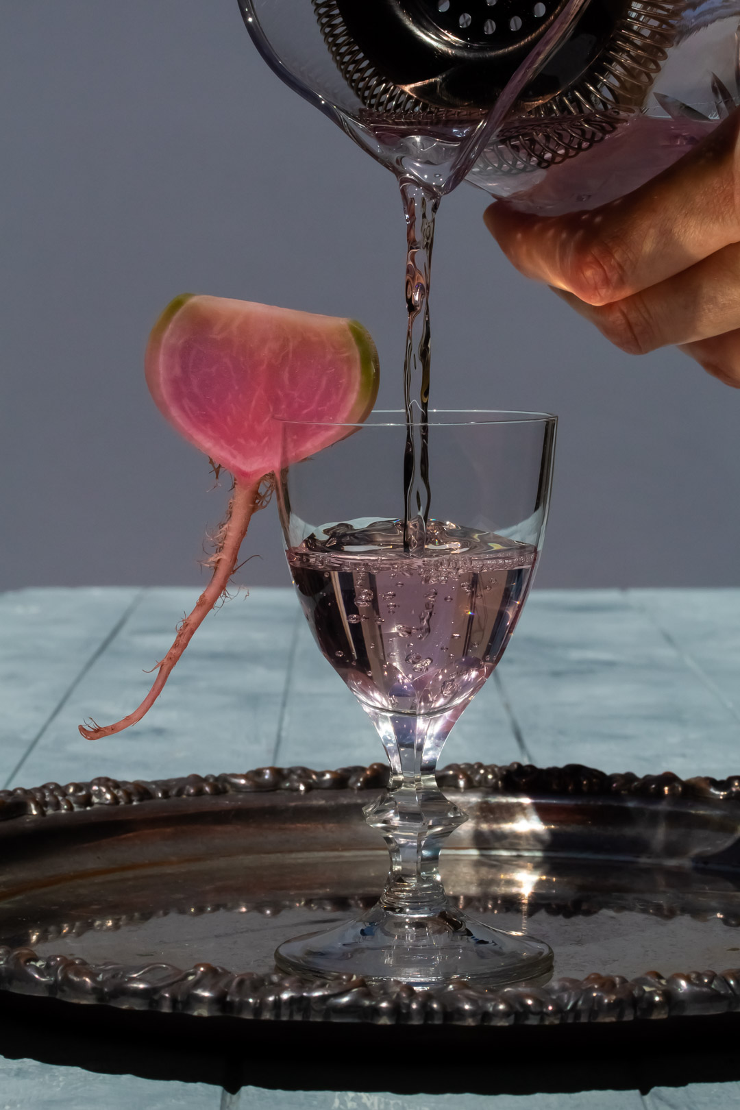 more pouring fermented watermelon radish martini with bubbles