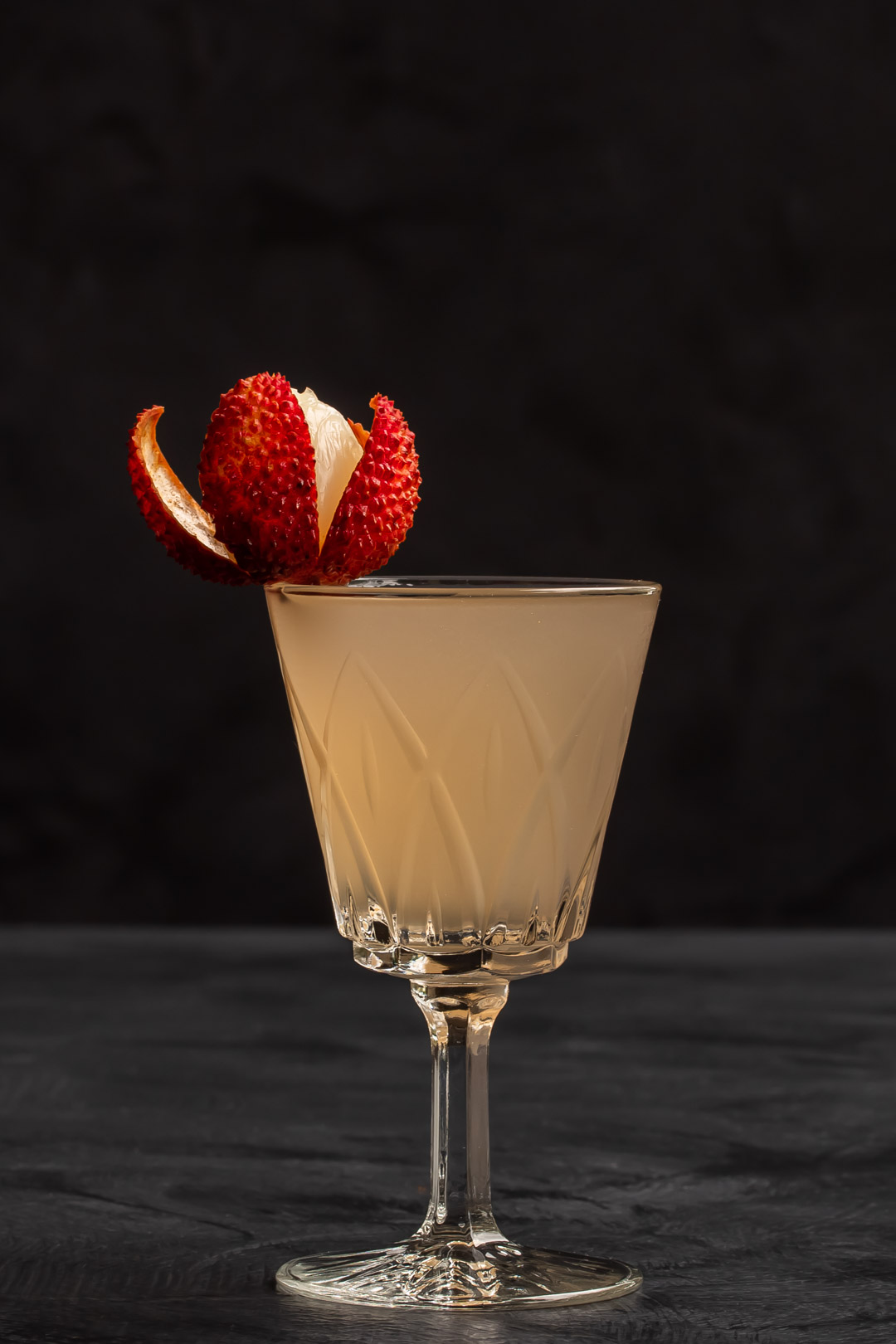 lychee reviver cocktail with lychee garnish