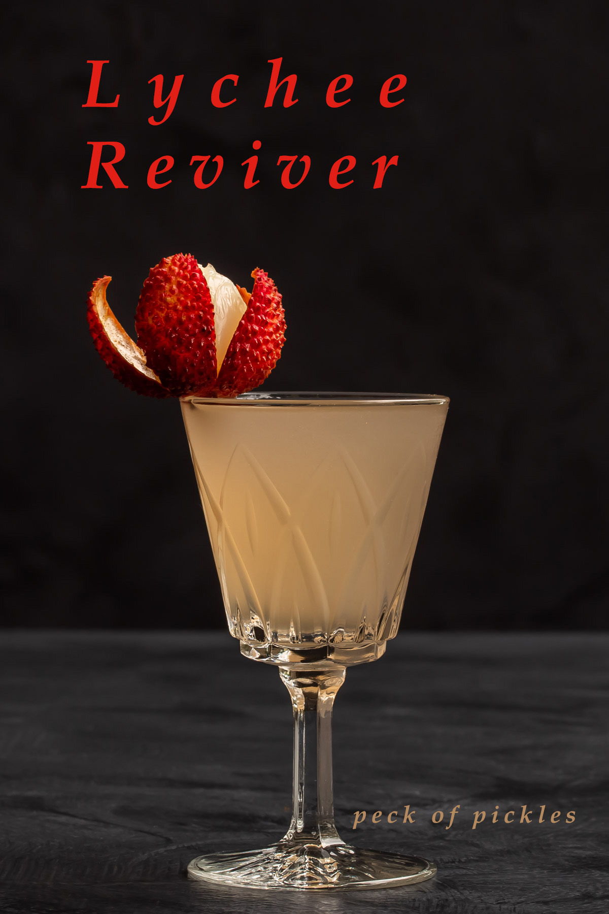 lychee reviver cocktail with lychee garnish