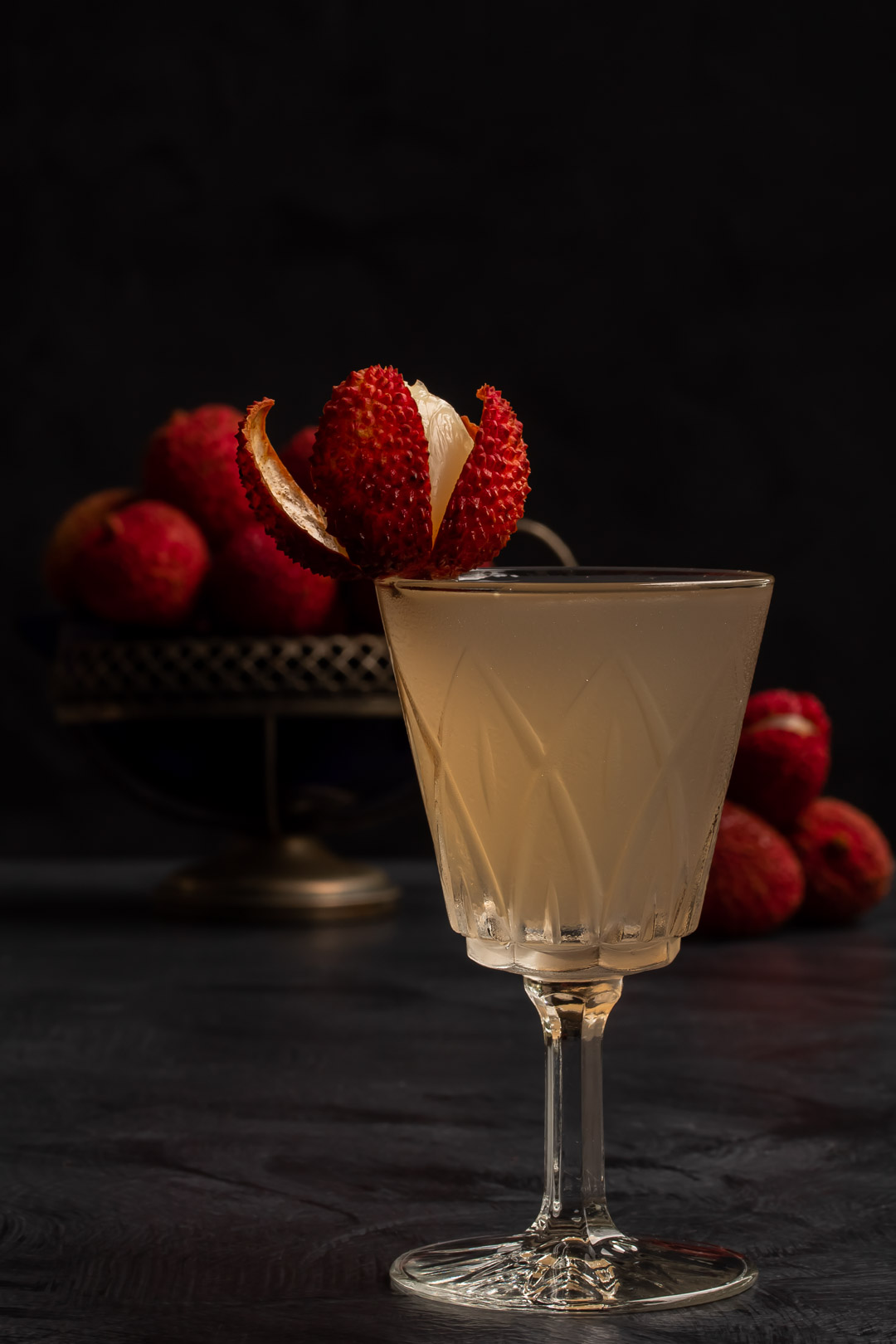 lychee reviver with lychees in background