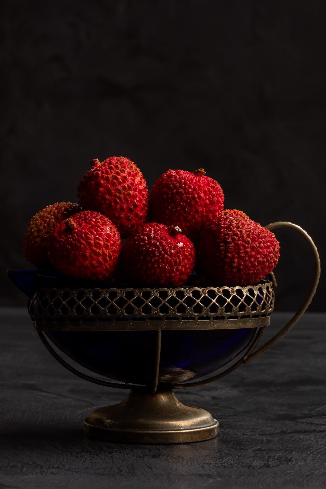 fresh lychees in vintage cream jug for lychee reviver cocktail