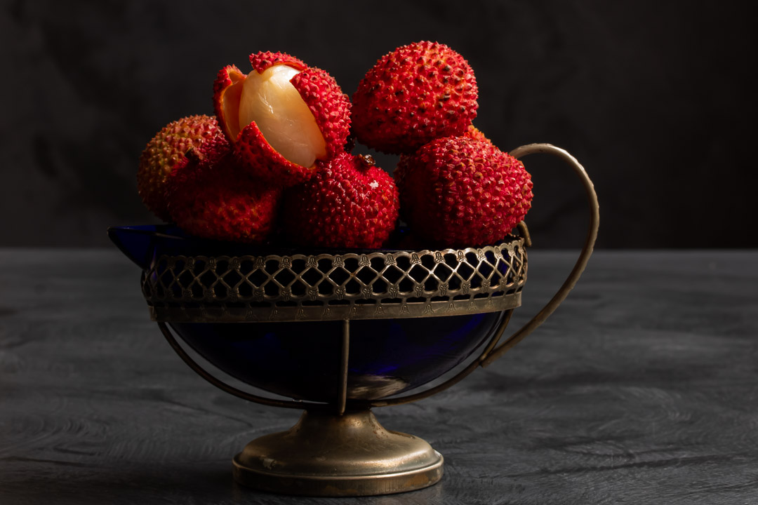 fresh lychees in vintage cream jug for lychee reviver cocktail