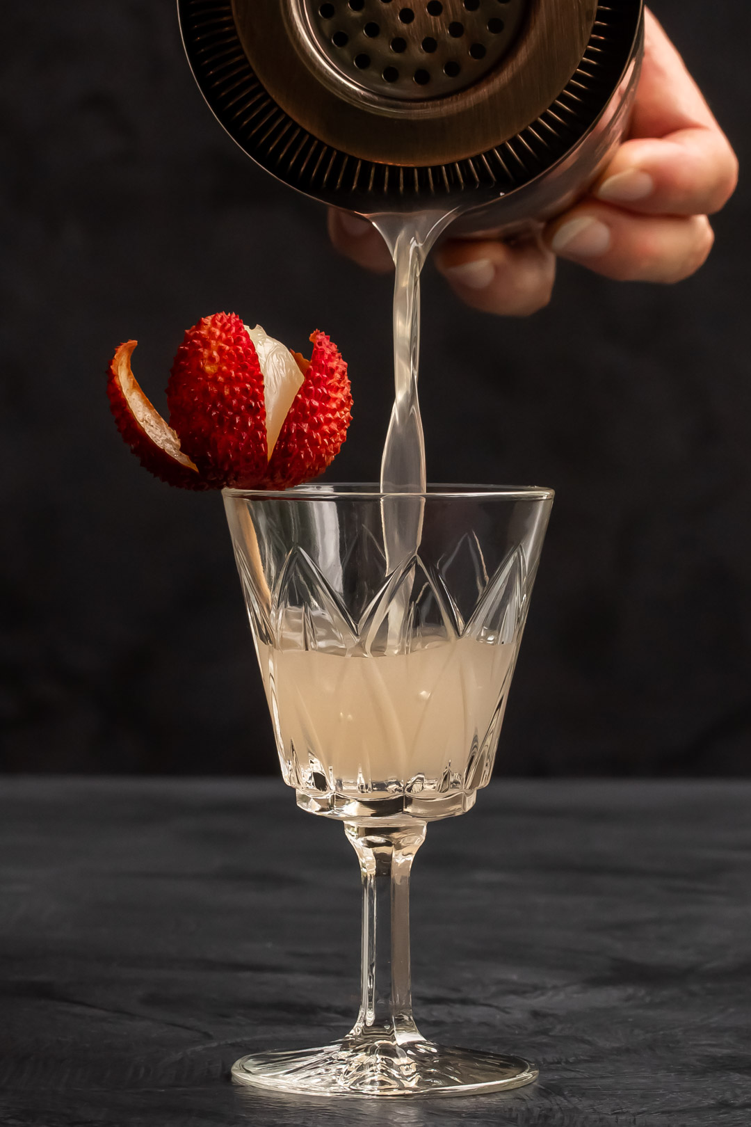 more pouring lychee reviver with lychee garnish