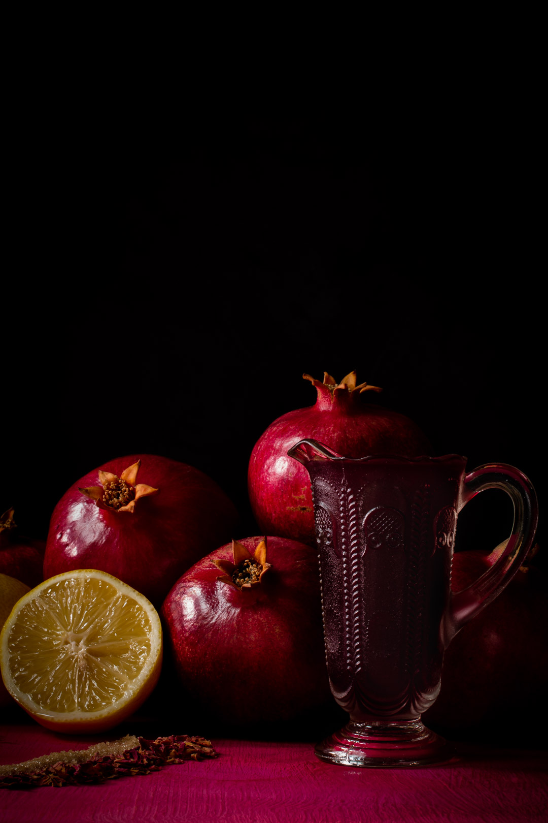 grenadine syrup in vintage jug for pomegranate and rose daisy