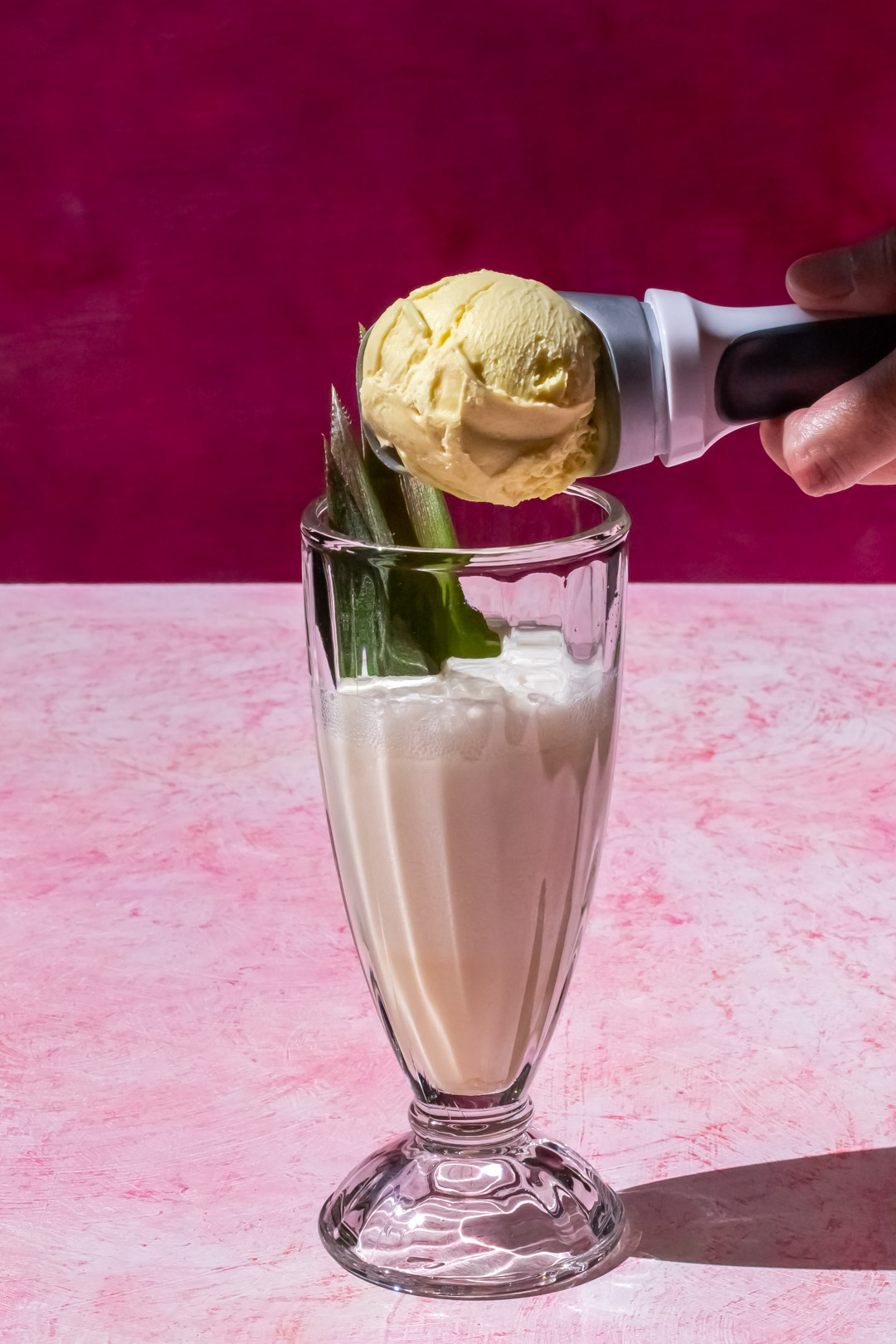 adding vanilla gelato to pineapple pistachio cream lactart