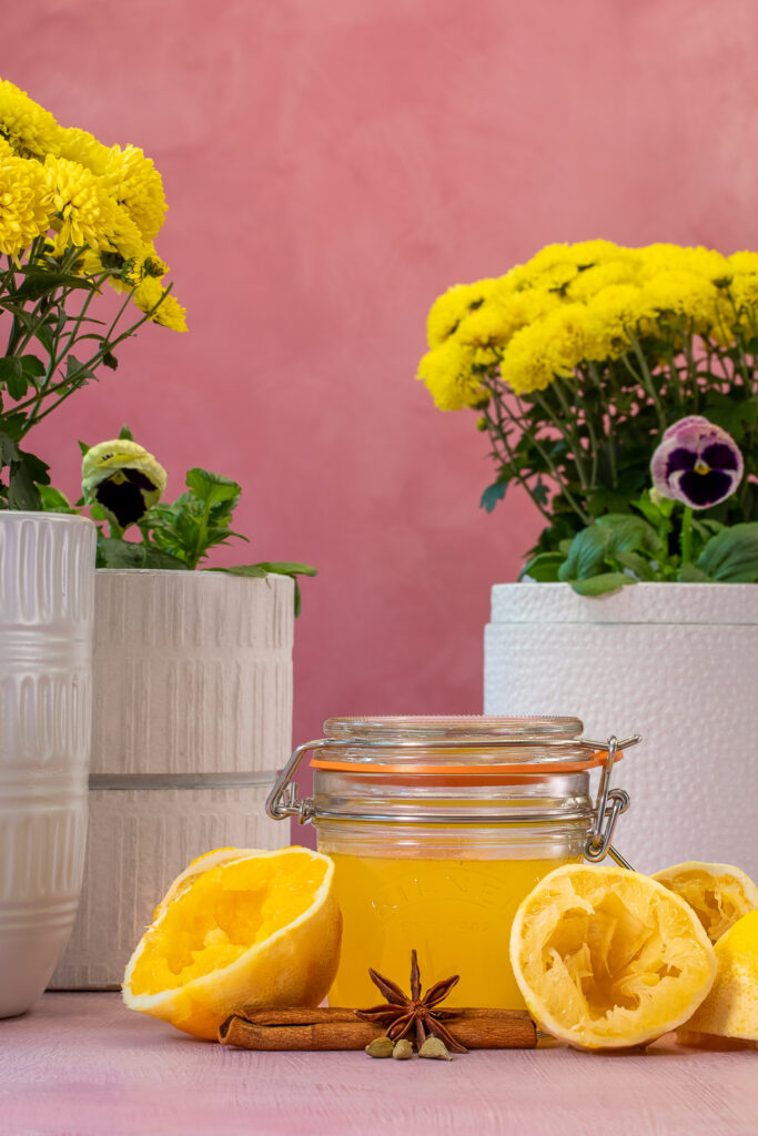 spiced lemon and orange oleo saccharum shrub for fancy honey bee cocktail