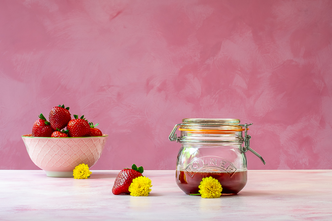 strawberry syrup horizontal with strawberries for use in strawberry tequila collins