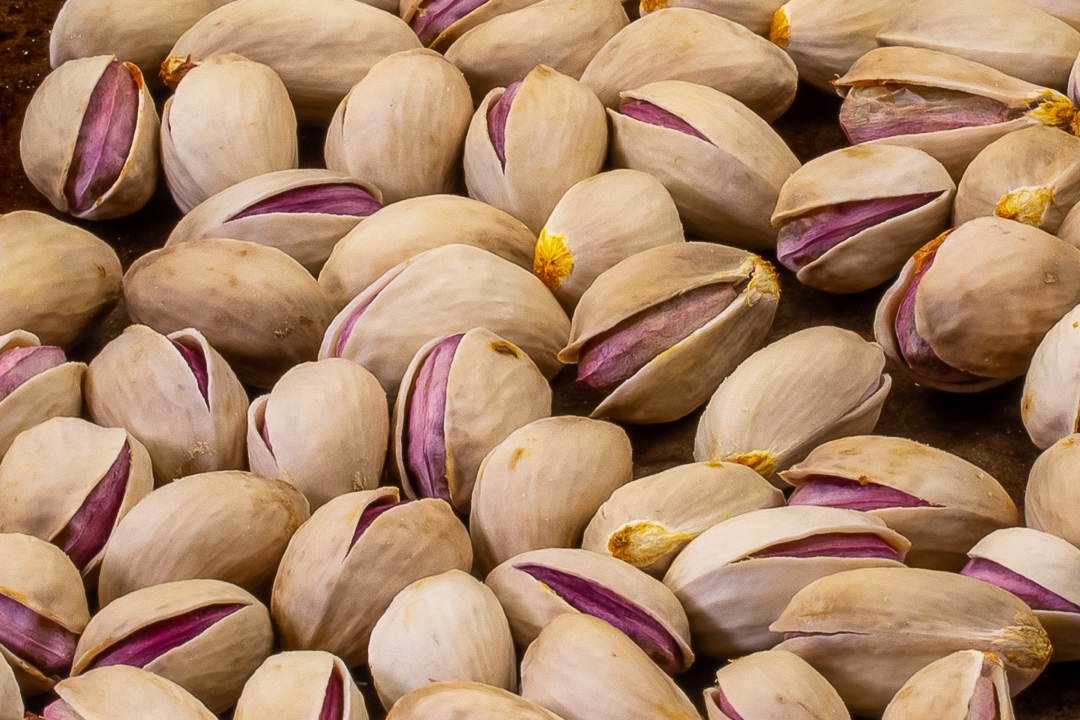 opened roasted pistachios closeup for pistachio syrup for use in pistachio limeade