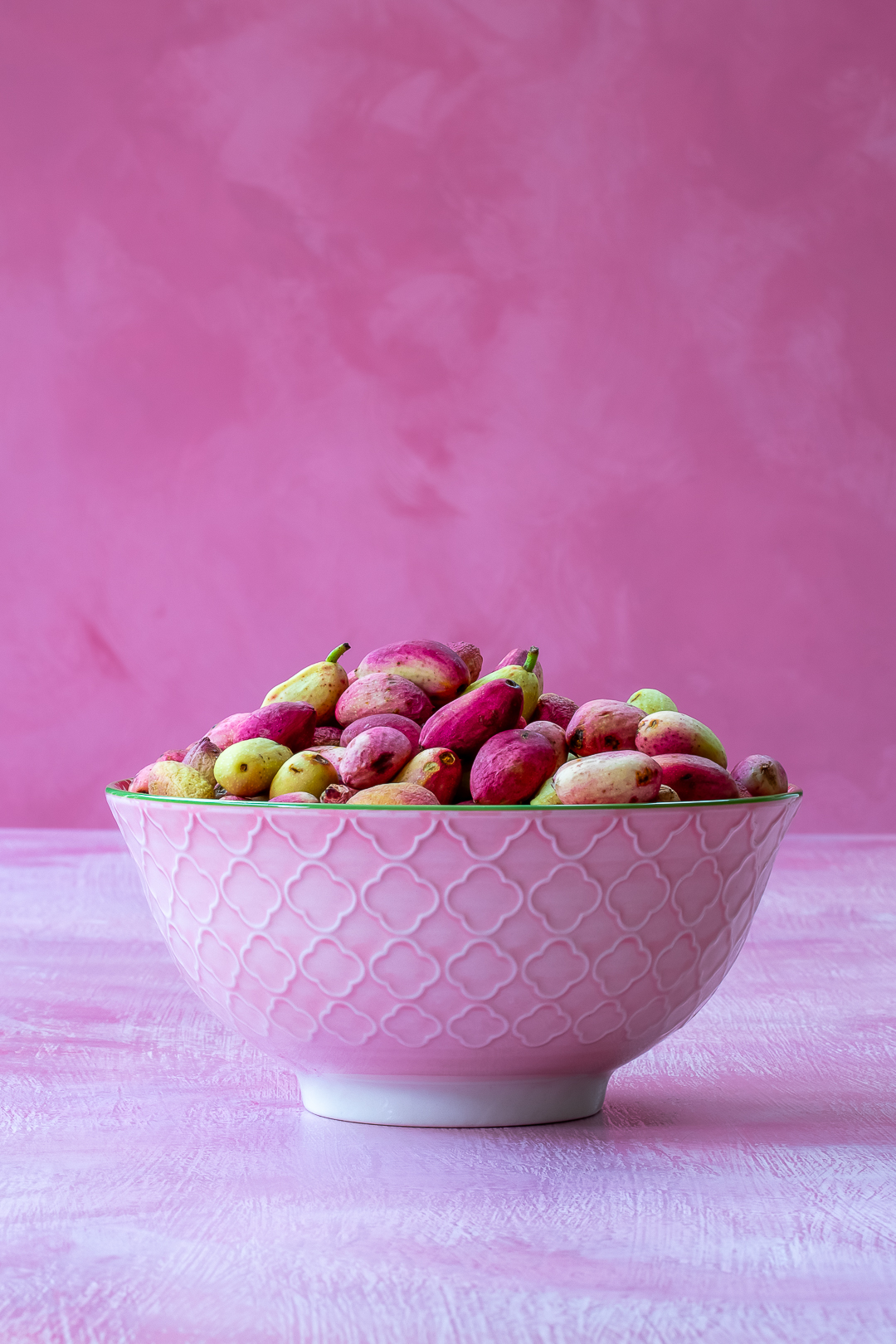 fresh pistachios in a dish for making pistachio syrup for pistachio limeade