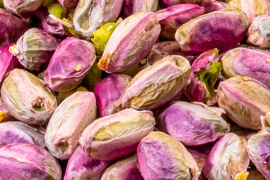 shelled pistachios close up for making pistachio syrup for use in pistachio limeade